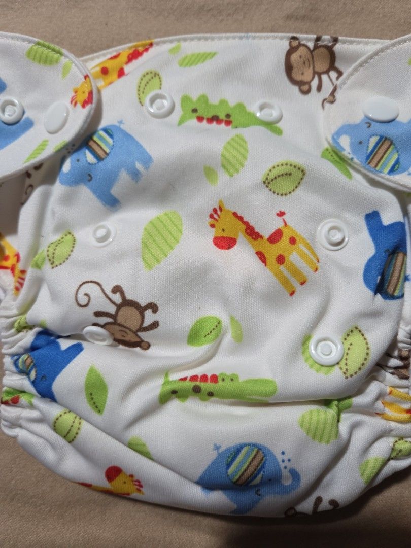 Lovable Lampin Cloth Diaper - Small to Medium (Category: Diapers & Baby Wipes) located in Quezon City. Submitted by klarebear15 (Listing ID 1393471102, Image 2). Description: - Lovable Lampin cloth diaper with fun animal print. - Features snap closures for easy adjustment. - Designed for small to medium-sized babies. - Made in China..