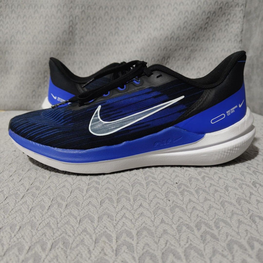 Nike Zoom Air Running Shoes Blue Black (Category: Sneakers) located in Manila. Submitted by james101194 (Listing ID 1393456098, Image 3). Description: Nike Zoom Air running shoes in blue and black. Features a blue and black striped upper with a white sole. The shoes have black laces and a Nike swoosh logo on the side. The size is US 8, UK 7, EUR 41, and CM 26. The style code is DD6203-004..