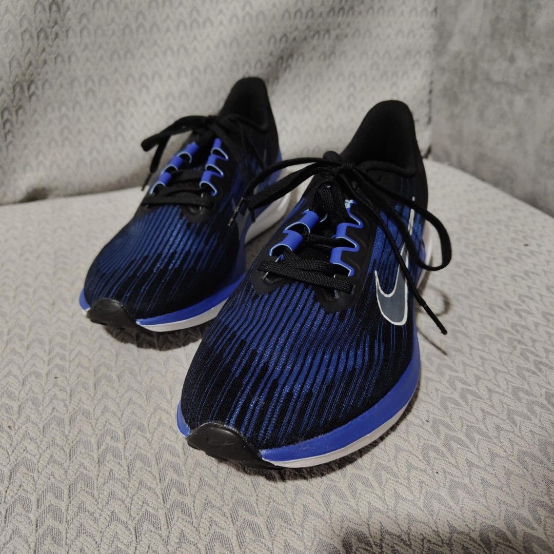 Nike Zoom Air Running Shoes Blue Black (Category: Sneakers) located in Manila. Submitted by james101194 (Listing ID 1393456098, Image 1). Description: Nike Zoom Air running shoes in blue and black. Features a blue and black striped upper with a white sole. The shoes have black laces and a Nike swoosh logo on the side. The size is US 8, UK 7, EUR 41, and CM 26. The style code is DD6203-004..
