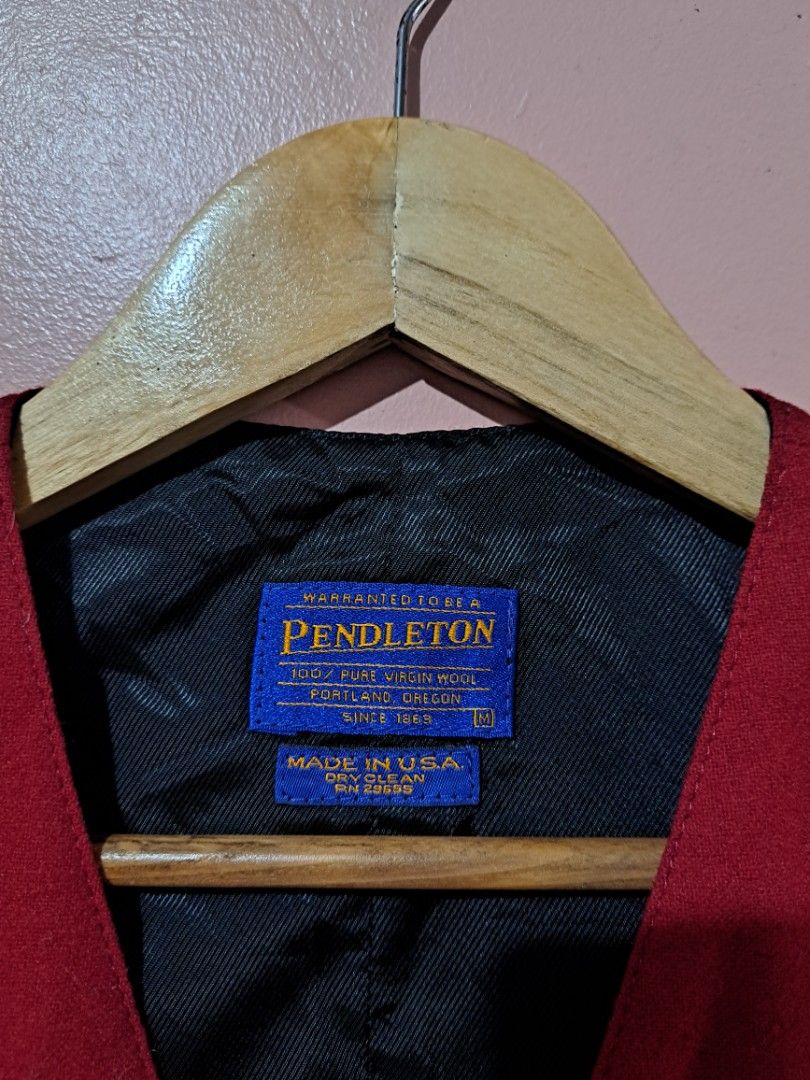 Pendleton Red Wool Vest (Category: Vests) located in Baguio. Submitted by randomthrifts2600 (Listing ID 1393561158, Image 3). Description: - Pendleton red vest - Size: M - Features: - Black lining - Three buttons - Material: 100% virgin wool - Made in USA - Care: Dry clean only No issue Size medium on tag W20 L24 .