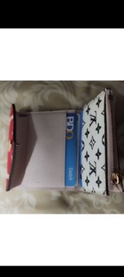 Preloved LV small wallet w/ code (Category: Luxury Bags & Wallets) located in Pasay City. Submitted by khim1202ma07307 (Listing ID 1363049151, Image 3). Description: Preloved LV small wallet w/ code.