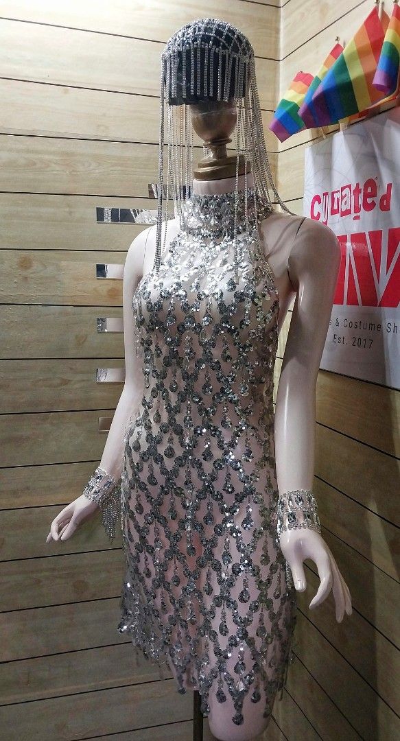 Silver Sequin Embellished Dress with Headpiece (Category: Dresses) located in Antipolo. Submitted by cvph17 (Listing ID 1393585585, Image 2). Description: - Silver sequin mini dress - Includes headpiece and wrist cuffs - High neckline - Intricate sequin detailing - Fitted silhouette - Mini length - Zipper closure - Ideal for special occasions.