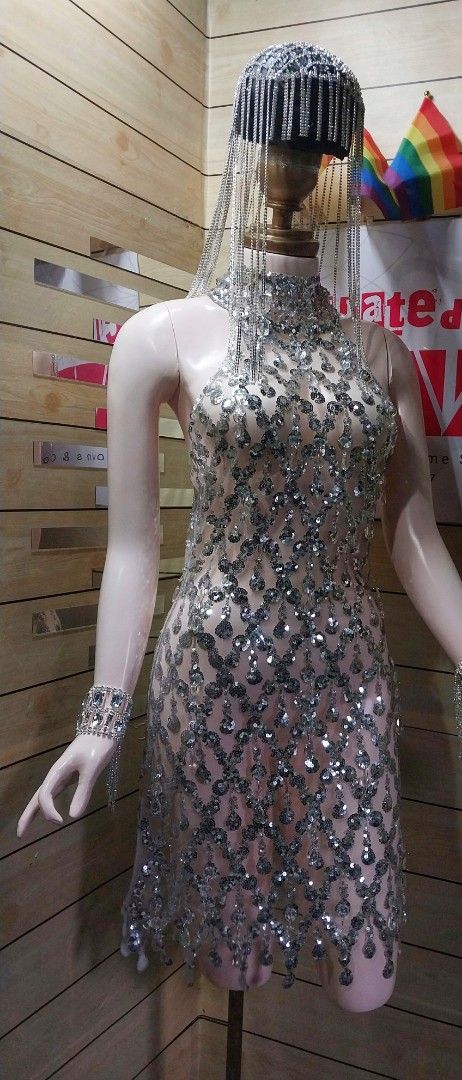 Silver Sequin Embellished Dress with Headpiece (Category: Dresses) located in Antipolo. Submitted by cvph17 (Listing ID 1393585585, Image 3). Description: - Silver sequin mini dress - Includes headpiece and wrist cuffs - High neckline - Intricate sequin detailing - Fitted silhouette - Mini length - Zipper closure - Ideal for special occasions.