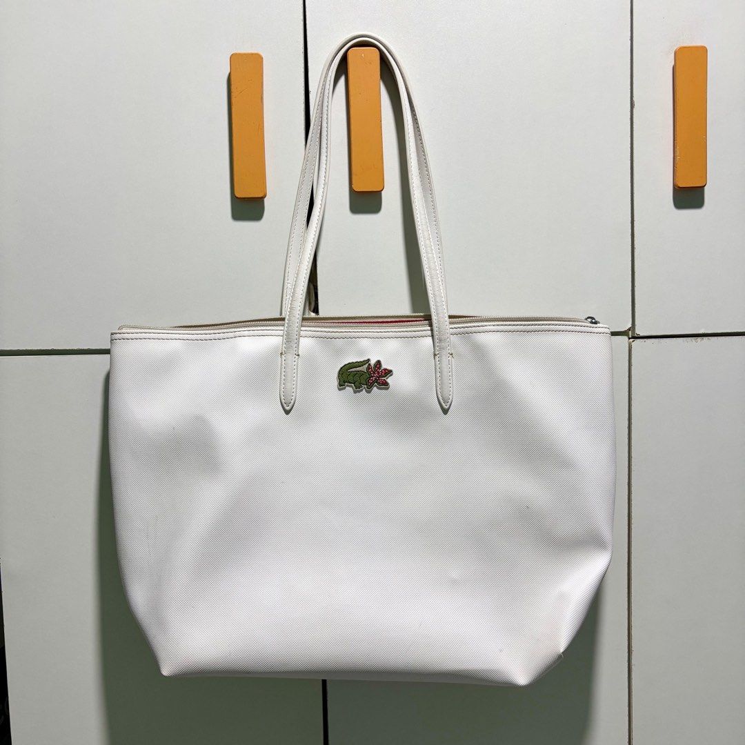 (AUTHENTIC 💯) Lacoste x Stranger Things Large Shoulder/Tote Bag (Category: Shoulder Bags) located in Manila. Submitted by codeofethixx (Listing ID 1390293294, Image 1). Description: ➡️ Used. No damage but may signs of usage. ❕Out of stock na to sa stores MOP: GCash, GoTyme & Seabank 📗 STRICTLY PAYMENT FIRST BEFORE SHIP OUT, i’ll accommodate request po to assure you of a legitimate transaction..