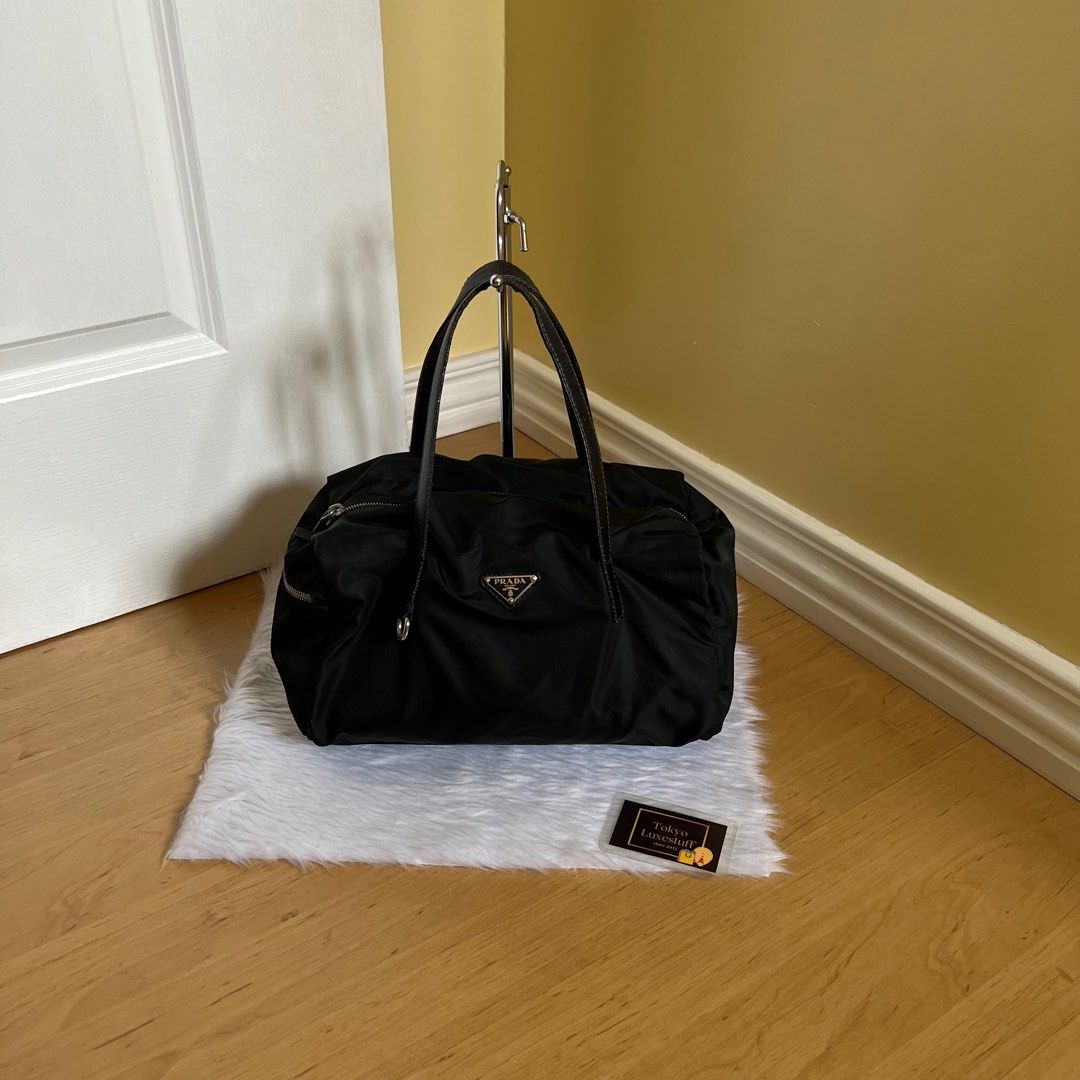 Authentic Preloved Prada Black Nylon Handbag (Category: Luxury Bags & Wallets) located in Quezon City. Submitted by tokyoluxestuff2013 (Listing ID 1390230036, Image 1). Description: Preloved Nylon Black Handbag Excellent used Approx. 30cm W x 17cm H Shipping via LBC / Grab/ Lalamove Add shipping fee.