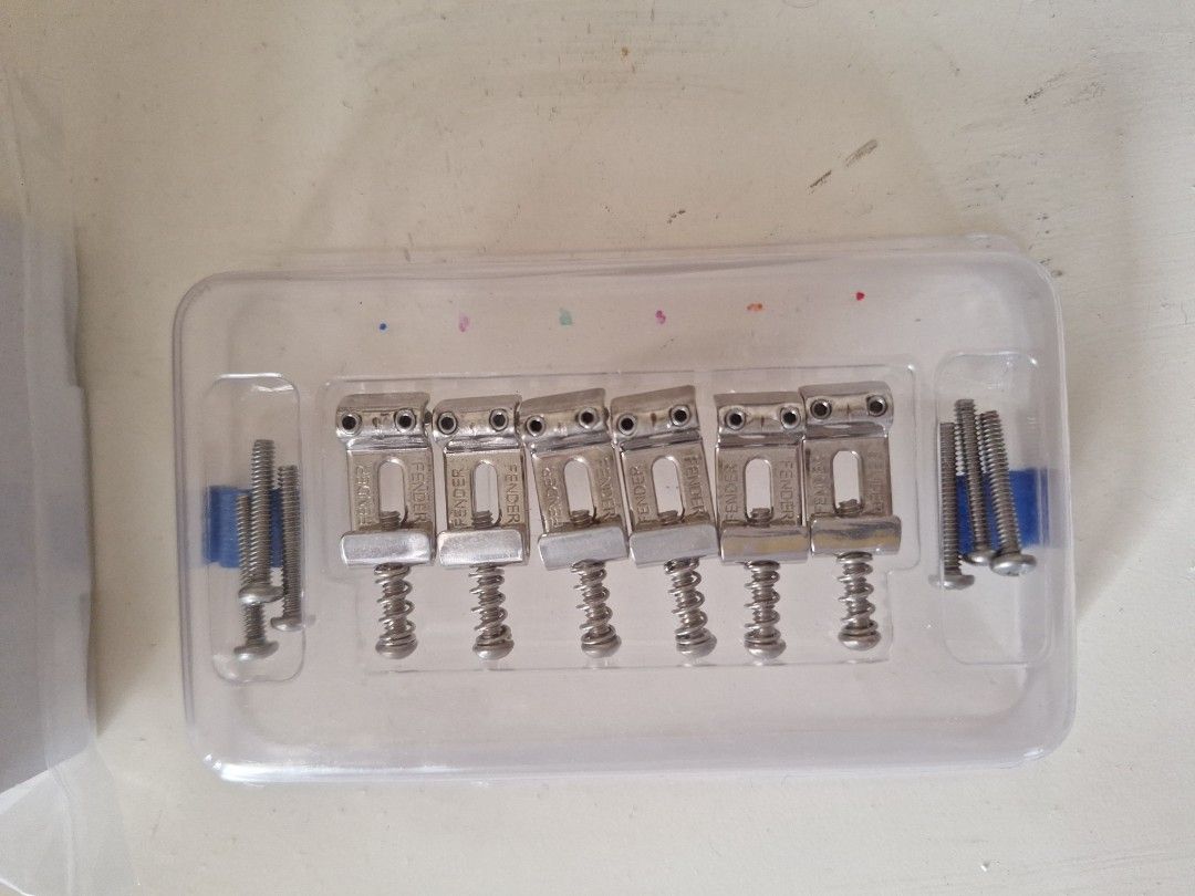 Fender original tuners and saddle set (Category: Musical Instruments) located in Quezon City. Submitted by grade_declutter (Listing ID 1390239618, Image 2). Description: Fender original tuners and saddle set tuning pegs is 6 inline right handed stratocaster. bent steel saddles decluttering some of my stuff. thank you meet up: sm fairview, FCM, ever commonwealth.
