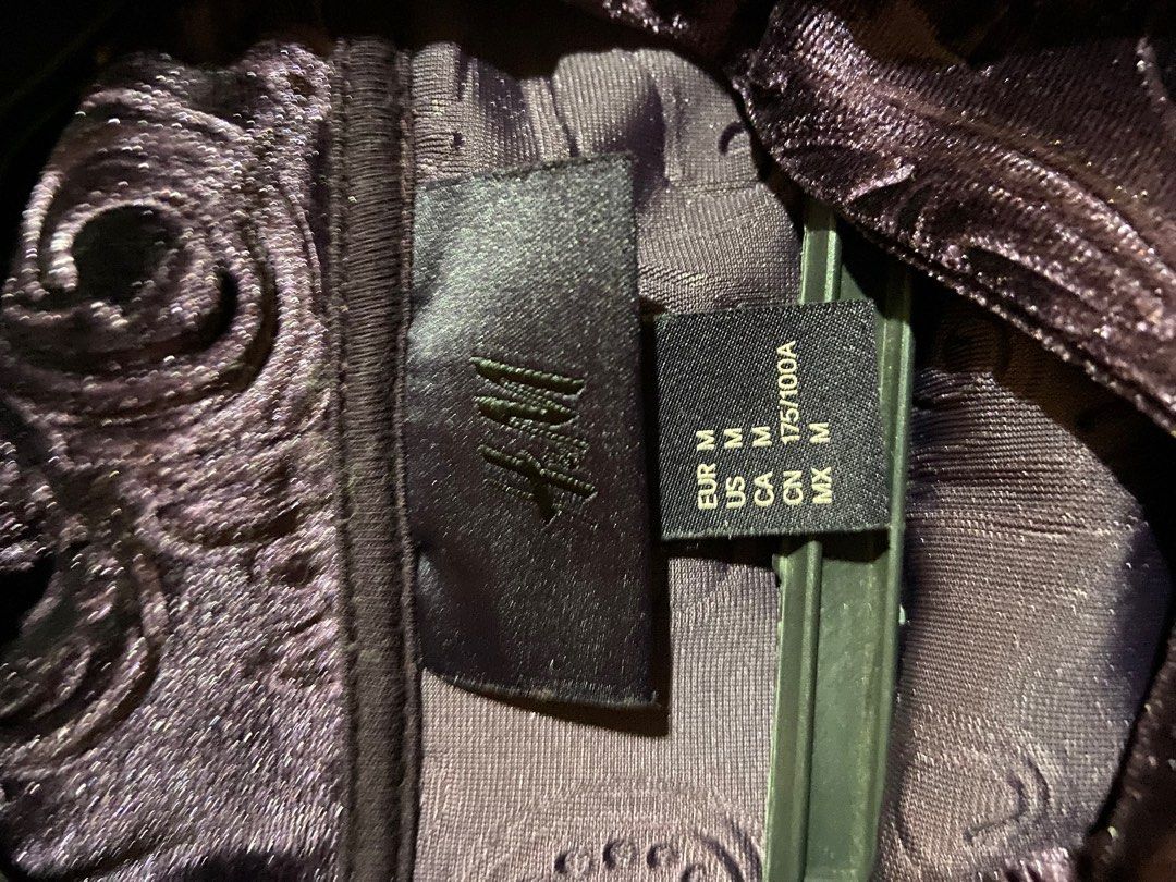 M | H&M Long Velour Pullover Hoodie (Category: Coats, Jackets and Outerwear) located in Apalit. Submitted by cdabs01 (Listing ID 1390274416, Image 3). Description: Color: Purple Material: 96% Polyester, 4% Spandex Remarks: - a bit oversized, best fits L to XL frames (unisex) - good as new, no issues, not too hot.
