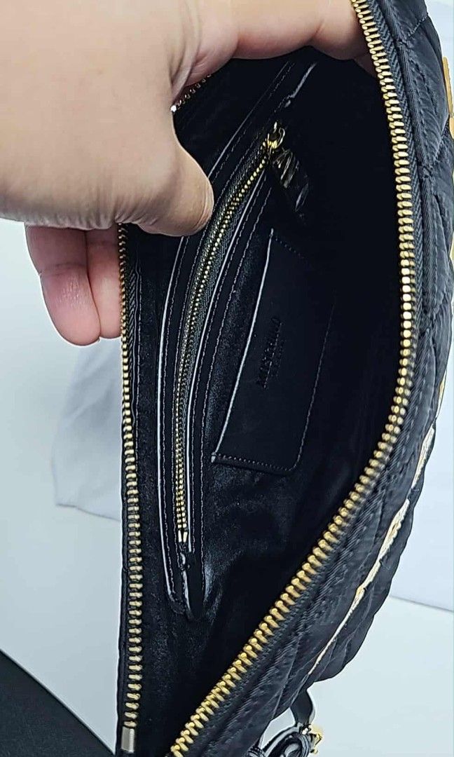 Moschino Quilted Clutch Nylon Bag (Category: Luxury Bags & Wallets) located in Manila. Submitted by BabyTheo06 (Listing ID 1390244436, Image 3). Description: with Dust bag.