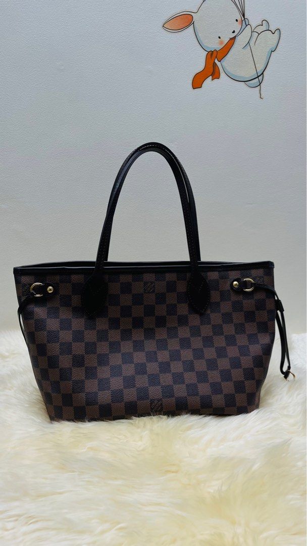 Neverful PM Ebene Damier (Category: Luxury Bags & Wallets) located in San Juan City. Submitted by kriszy_coo (Listing ID 1390269839, Image 1). Description: Neverfull PM Damier Ebene Date Code AR2142 Php 66,000 Bought in Japan.