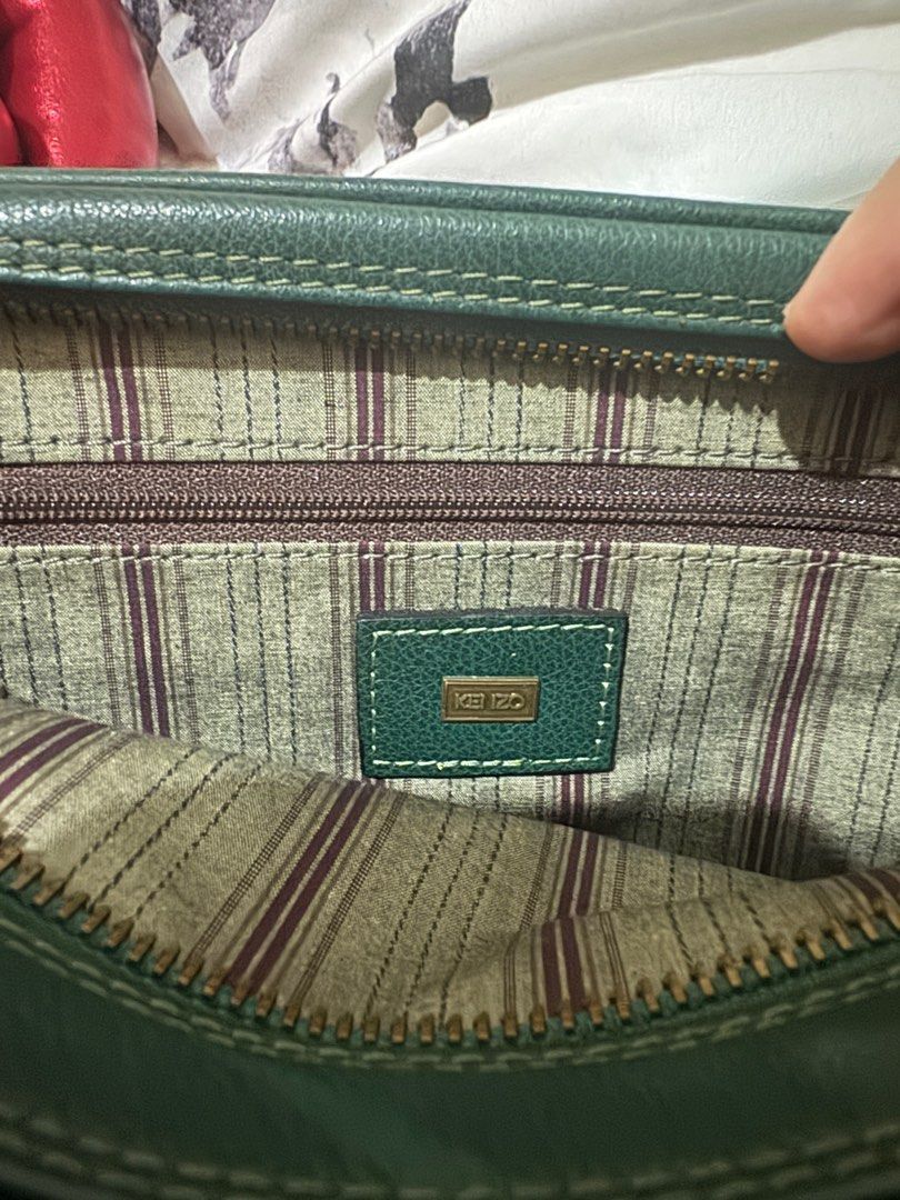 Original Kenzo Leather Clutch Bag (Category: Luxury Bags & Wallets) located in Cebu City. Submitted by timeninja (Listing ID 1390315646, Image 3). Description: Original. Genuine Leather. In good condition. Cebu City area..