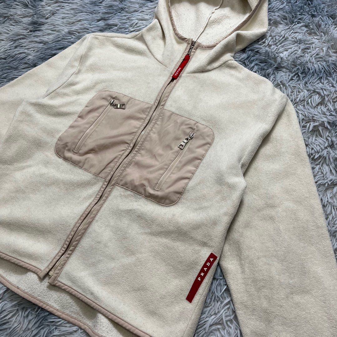 Prada Fleece Red tab jacket (Category: Luxury Apparel) located in Dumaguete. Submitted by dgte.grails (Listing ID 1390343939, Image 2). Description: Prada Fleece Red tab jacket 20 width 22 length Excellent condition 1500 Pm.