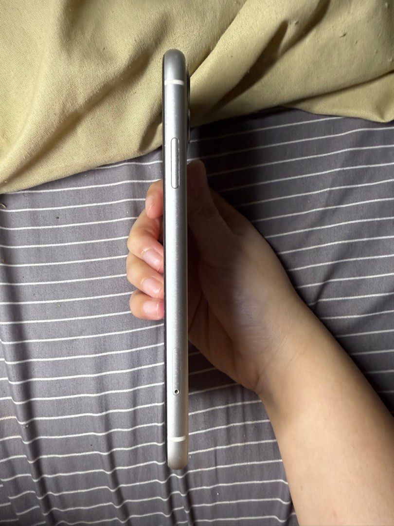 White Iphone 11 (Category: iPhone 11 Series) located in Mandaluyong City. Submitted by aimr_ (Listing ID 1390340361, Image 3). Description: 13,000 (negotiable) 64 GB 69% Batt Health Dual Sim (bought from HK) With box (no charger) Minimal scratches on screen (not noticeable) Minimal dent on right corners (not noticeable) RFS: Upgrading.
