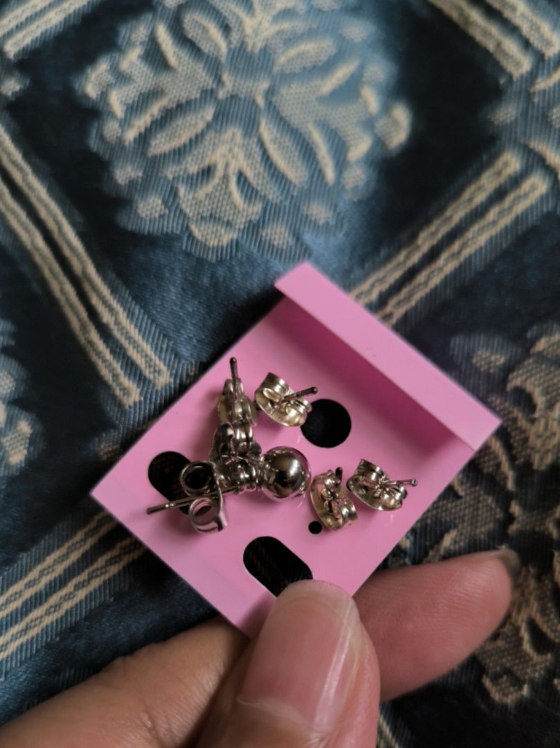 Ball Stud Earrings (Category: Earrings) located in Cainta. Submitted by cookietherapyph (Listing ID 1393620901, Image 2). Description: Php 45 take all, Php20/pair Unused but 2 of them have the original pakaw and the rest have been replaced with new pakaw, hence, the slight difference in color I think this is 4mm balls RFS: Decluttering MOP: Gcash Shipping: J&T Loc: Cainta, Rizal .