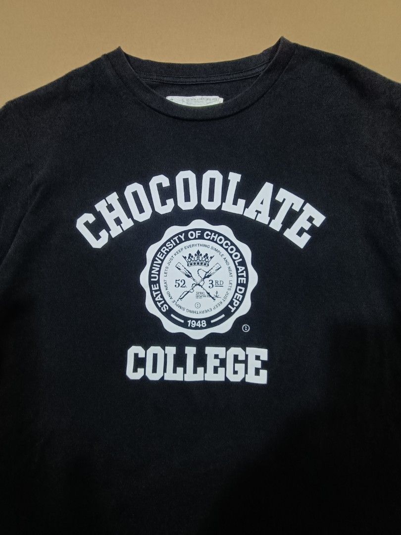 Black Chocolate College T-shirt Medium (Category: Tshirts & Polo Shirts ) located in Quezon City. Submitted by selectorsthrift (Listing ID 1393727893, Image 2). Description: - Brand: Black Chocolate - Style: College T-shirt - Size: Medium - Design: 'CHOCOOLATE COLLEGE' print on front - Neckline: Crew neck - Sleeves: Short sleeves - Measurements: 19x25.