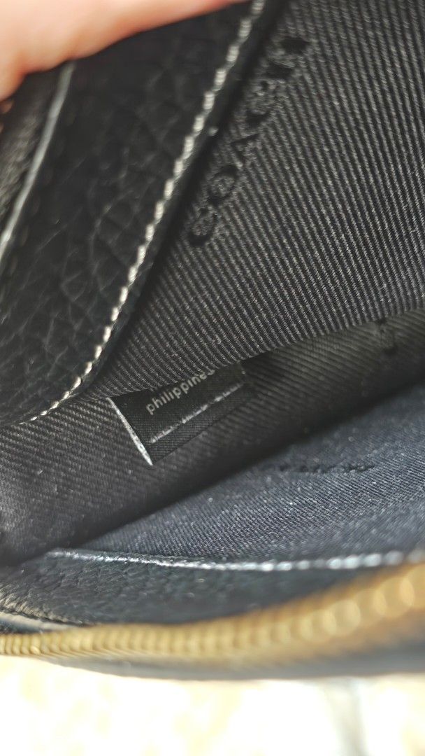 Coach Noa Sling Wallet (Category: Luxury Bags & Wallets) located in Taguig. Submitted by the.seekers.ph (Listing ID 1393783647, Image 3). Description: - Authentic Coach crossbody bag - Color: Black - Detachable strap - Closure: Zip and snap - Includes Coach hangtag and card - Interior tag: 'Philippines'.