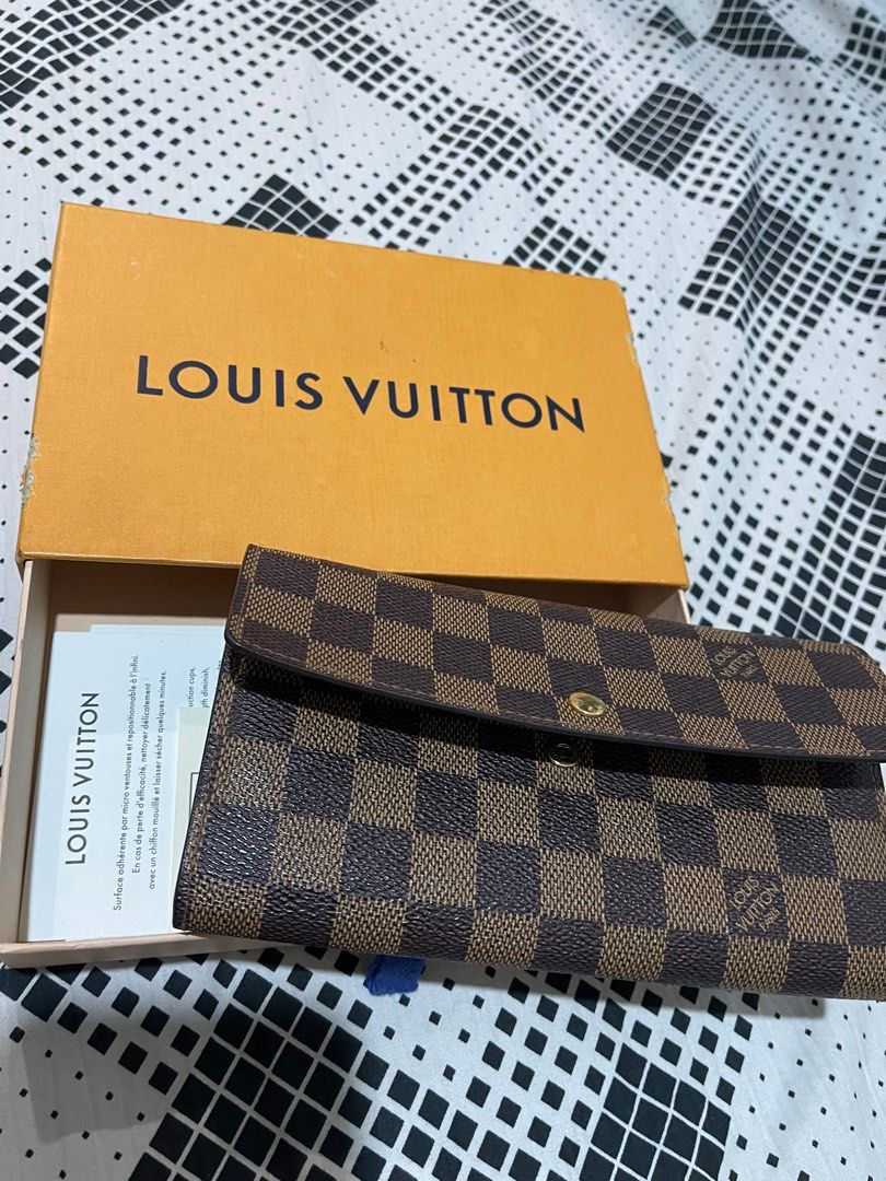 LV Sarah Damier Ebene Wallet (Category: Luxury Bags & Wallets) located in Pasig City. Submitted by owenmaye (Listing ID 1393799827, Image 1). Description: Guaranteed authentic! LV Sarah Damier Ebene Wallet Stanp: MB0075 year:2005. Maganda pa. Last price posted na po. Will not reply to messages asking for last price. Pick-up: Pasig area Delivery shouldered by the buyer. Gcash/ metrobank payments. .