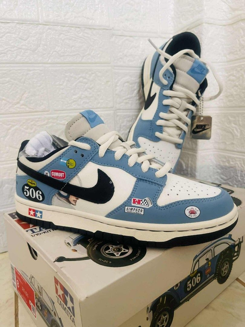 Nike Dunk Low Tamiya (Category: Sneakers) located in Dasmarinas. Submitted by melaina (Listing ID 1393752458, Image 1). Description: - Nike Dunk Low sneakers - Blue and white colorway - Black swoosh - Racing-themed patches - Includes original box with racing car design - Comes with Nike tag - Unworn condition 4 sizes available Women's or teens size.