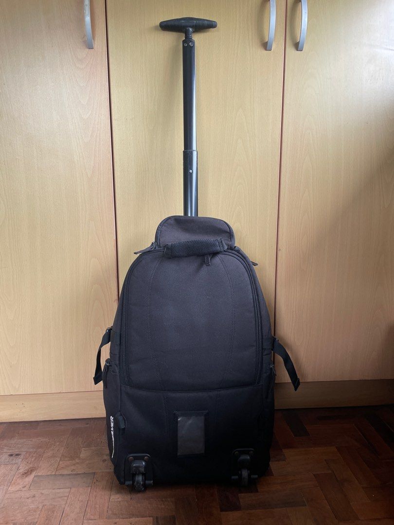 Quiksilver Roller Backpack (Category: Backpacks) located in Muntinlupa City. Submitted by mercadonna (Listing ID 1393663539, Image 3). Description: Travel backpack that transforms into a roller bag. Issues: Damaged logo and wheels, handle tends to get stuck when extending.