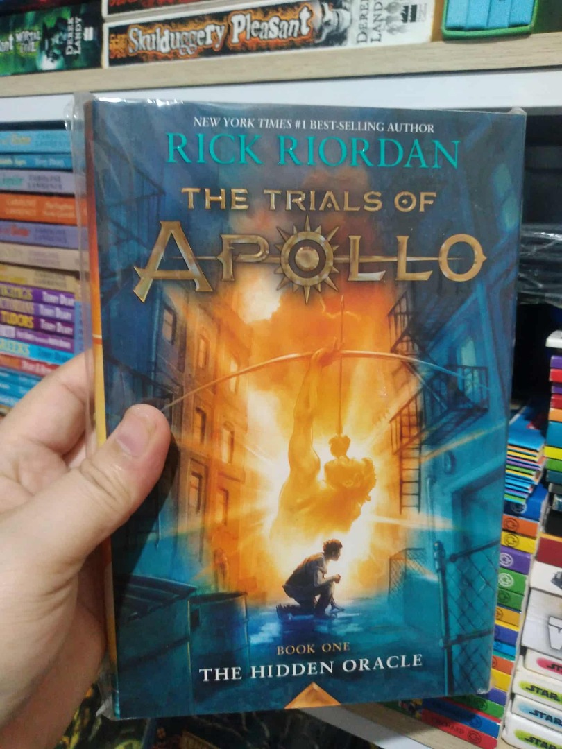 RICK RIORDAN'S THE TRIALS OF APOLLO - THE HIDDEN ORACLE (HARDBOUND ...