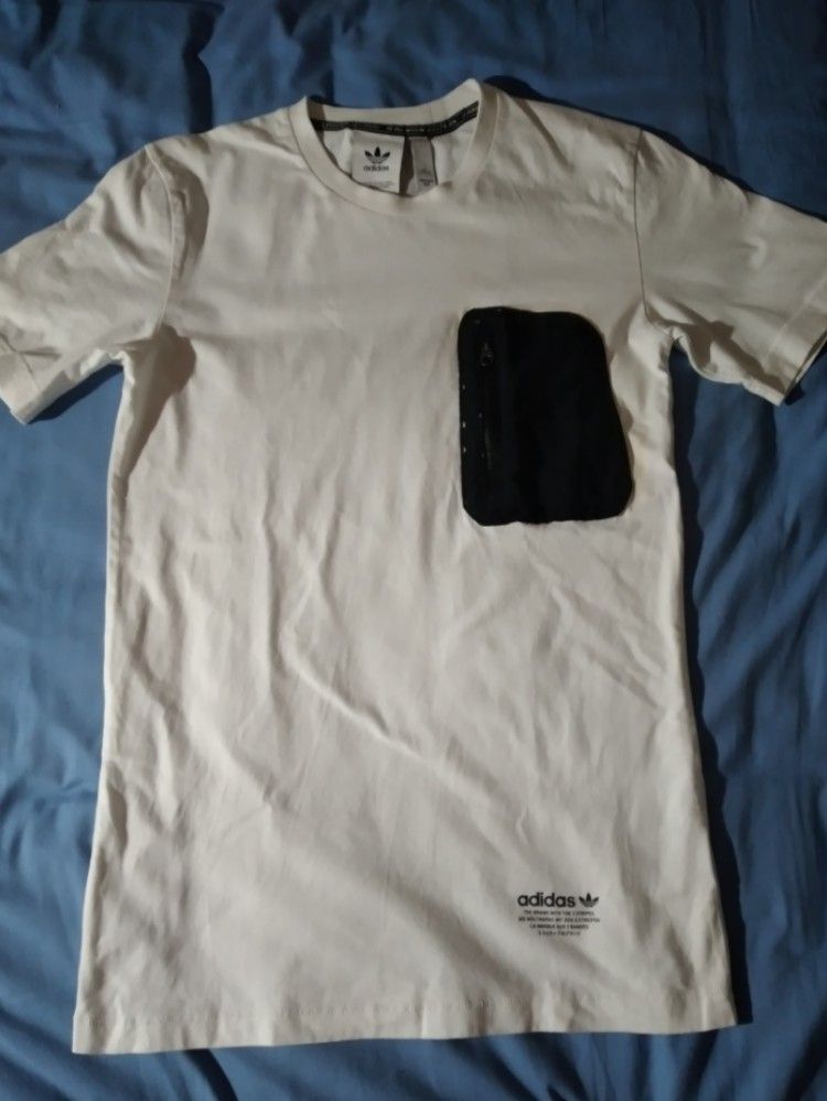 Adidas white shirt (Category: Activewear) located in Makati City. Submitted by closet.declutterph (Listing ID 1393913235, Image 2). Description: 200 each 350 both like new no flaws.