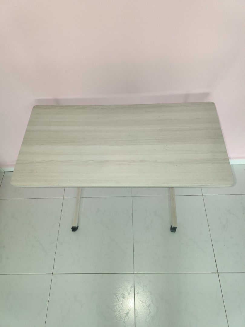 Adjustable Study Table with Wheels (Category: Tables & Sets) located in Singapore. Submitted by linailing (Listing ID 1389229934, Image 2). Description: Self Collect at 730677 W 40cm x L80cm x H 66cm.