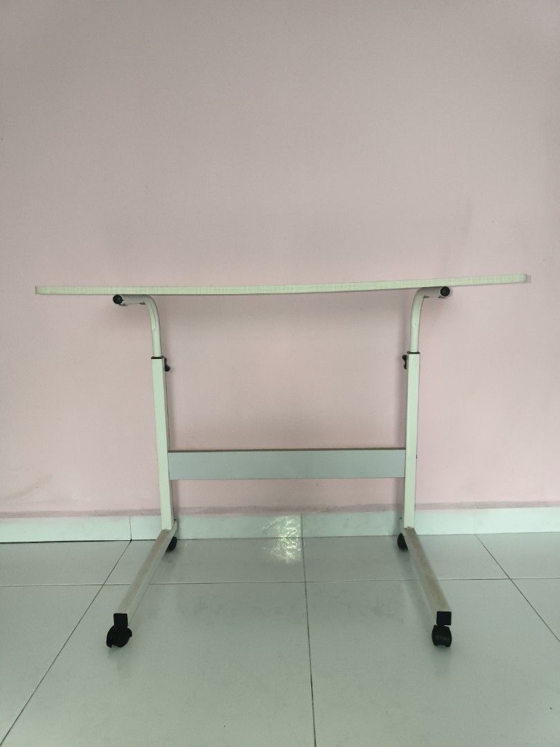 Adjustable Study Table with Wheels (Category: Tables & Sets) located in Singapore. Submitted by linailing (Listing ID 1389229934, Image 1). Description: Self Collect at 730677 W 40cm x L80cm x H 66cm.