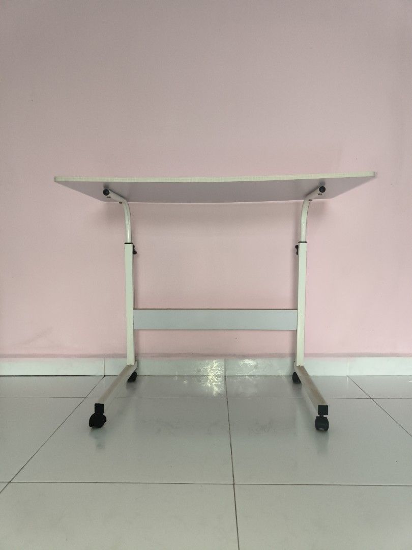 Adjustable Study Table with Wheels (Category: Tables & Sets) located in Singapore. Submitted by linailing (Listing ID 1389229934, Image 3). Description: Self Collect at 730677 W 40cm x L80cm x H 66cm.
