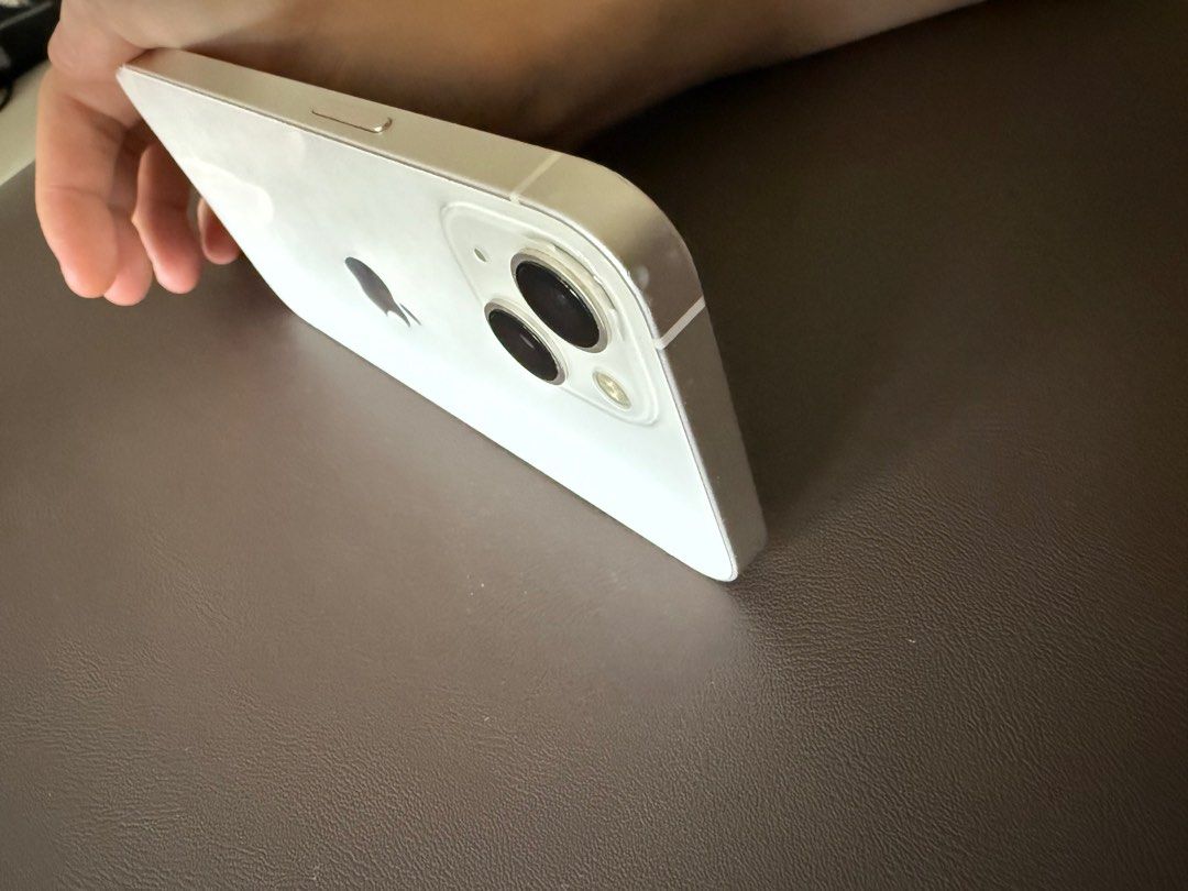 (Category: iPhone 13 Series ) located in Singapore. Submitted by blueblewbrew (Listing ID 1393973636, Image 3). Description: - iPhone 13 (White) - Battery Health: 83% - Fully functional - Includes charging port.