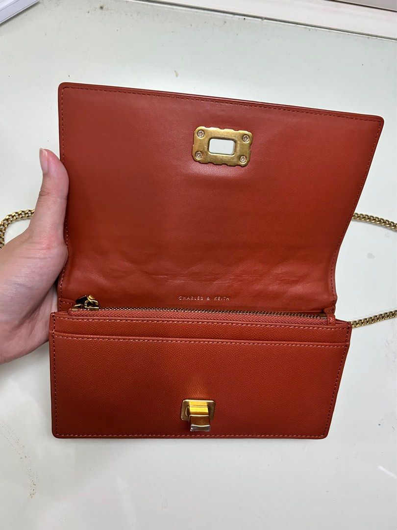 Charles&Keith Quilted Long Wallet Bag (Category: Luxury Bags & Wallets) located in Manila. Submitted by sammyyy19 (Listing ID 1393913527, Image 2). Description: Charles & Keith Quilted Long Wallet With Gold Hardware With minor wear and tear at lock but not super visible (see photo) No discoloration No rusting of chain strap No peeling of leather No scratches Condition: 8/10.