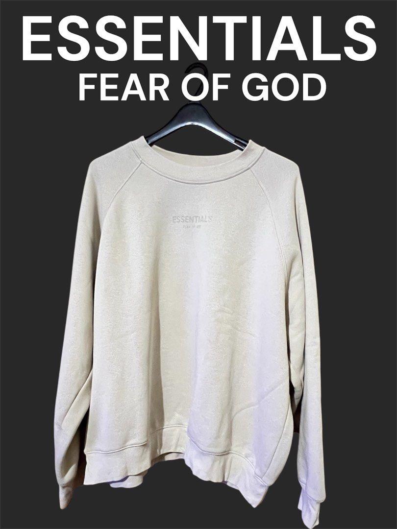 ESSENTIALS (FOG) - Pullover (Category: Coats, Jackets and Outerwear) located in Valenzuela. Submitted by gotdrip (Listing ID 1393934760, Image 1). Description: Fear of God Essentials Pullover • Color: Light beige / oatmeal tone • Size: Medium but best fit large • Style: Crewneck pullover • Material: Soft cotton-blend fleece (comfortable and cozy for everyday wear) • Design: Minimalist design with ESSENTIALS Fear of God logo subtly printed on the 