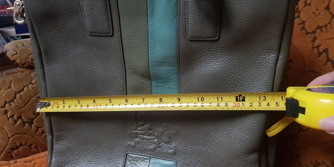Grayish-green MCM leather 2-way bag (Category: Cross-body Bags) located in Quezon City. Submitted by practibagsplusmnl (Listing ID 1393877943, Image 2). Description: Grayish-green MCM leather 2-way bag; original sling vertical, box-type. Thick, heavy, but soft leather..