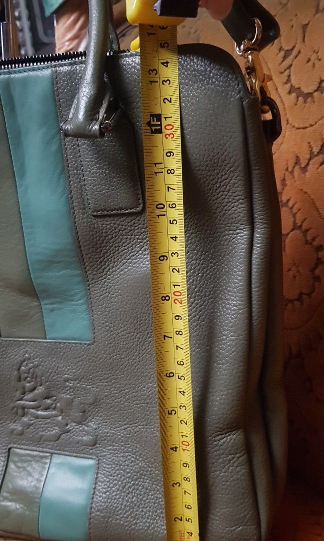 Grayish-green MCM leather 2-way bag (Category: Cross-body Bags) located in Quezon City. Submitted by practibagsplusmnl (Listing ID 1393877943, Image 3). Description: Grayish-green MCM leather 2-way bag; original sling vertical, box-type. Thick, heavy, but soft leather..