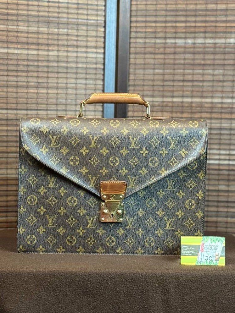 Louis Vuitton Serviette Conseiller Monogram (Category: Luxury Bags & Wallets) located in Baguio. Submitted by BagstacularbyJCT (Listing ID 1393936348, Image 1). Description: The LV Serviette Conseiller in monogram canvas is a briefcase bag ideal for carrying documents or gadgets for work, study, or business. The bag opens through a crossover flap secured with a v-shaped press lock. The interior features two compartments and a pocket for easy orga
