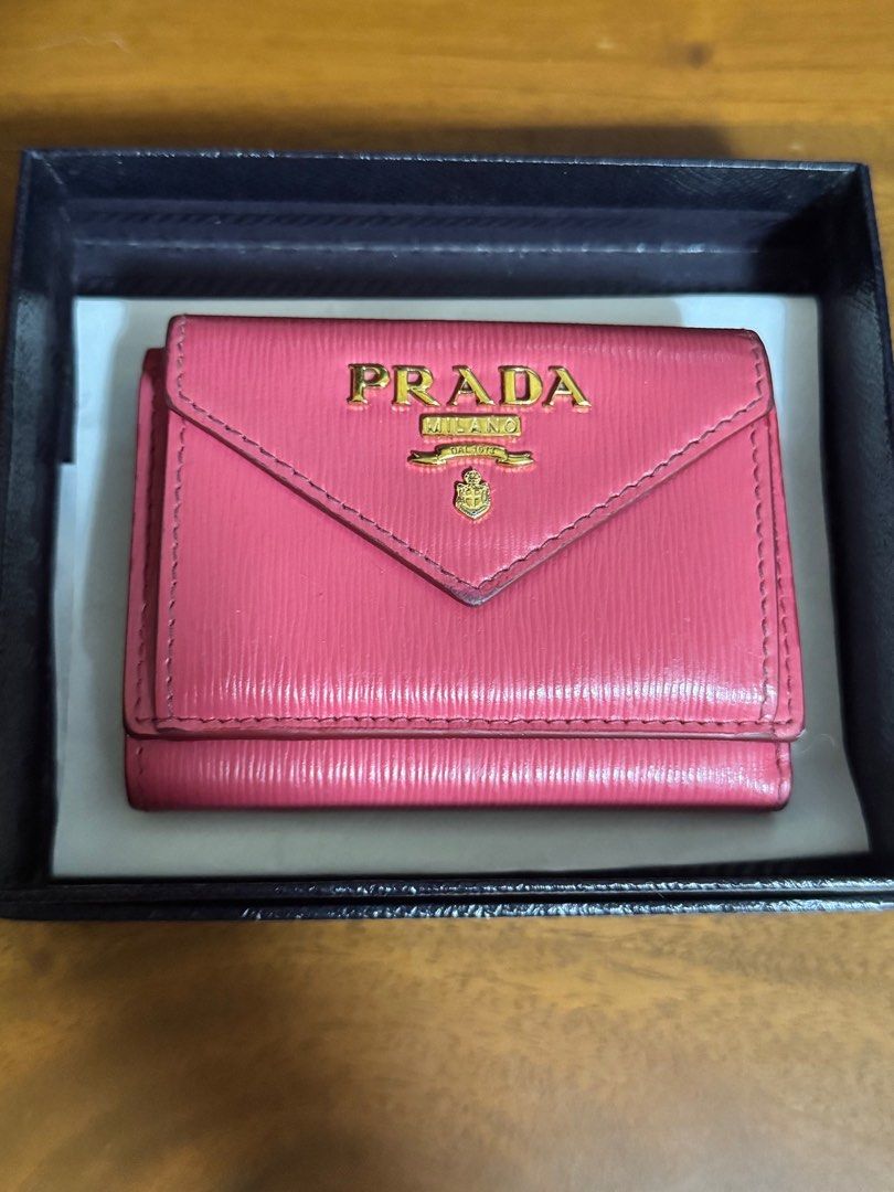 Prada Pink Leather Tri-Fold Wallet (Authentic) (Category: Luxury Bags & Wallets) located in Quezon City. Submitted by kmaeb (Listing ID 1393976469, Image 1). Description: Authentic Comes with box RFS: decluttering SF shouldered by buyer .