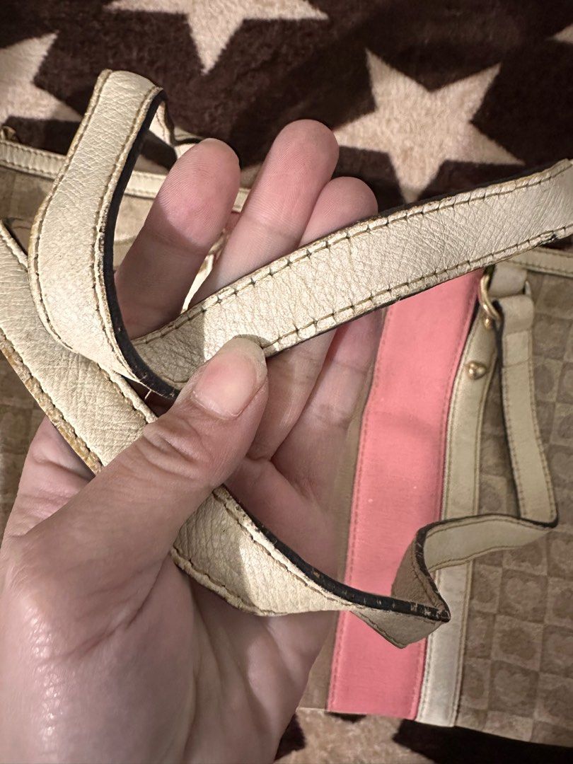 Preloved lovcat tote (Category: Luxury Bags & Wallets) located in Cavite. Submitted by shielambot (Listing ID 1393826926, Image 2). Description: Preloved lovcat tote bag 🔘 micro chops on leather parts 🔘discoloration on straps 🔘 rubber lining incomplete .
