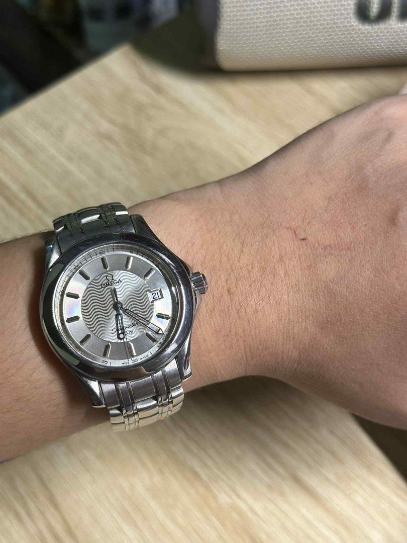 Seamaster 120m ‘Wave’ 1993 (Category: Luxury Watches) located in Batangas. Submitted by jiyayayaya (Listing ID 1393925802, Image 2). Description: Seamaster 120m ‘Wave’ 1993 ⌚️Ref No: 196.1501/ 396.1501 ⌚️Quartz movement ⌚️Case diameter: 36mm ⌚️Minimal marks on dial due to age ⌚️18k solid gold logo on clasp already valued at 18k.