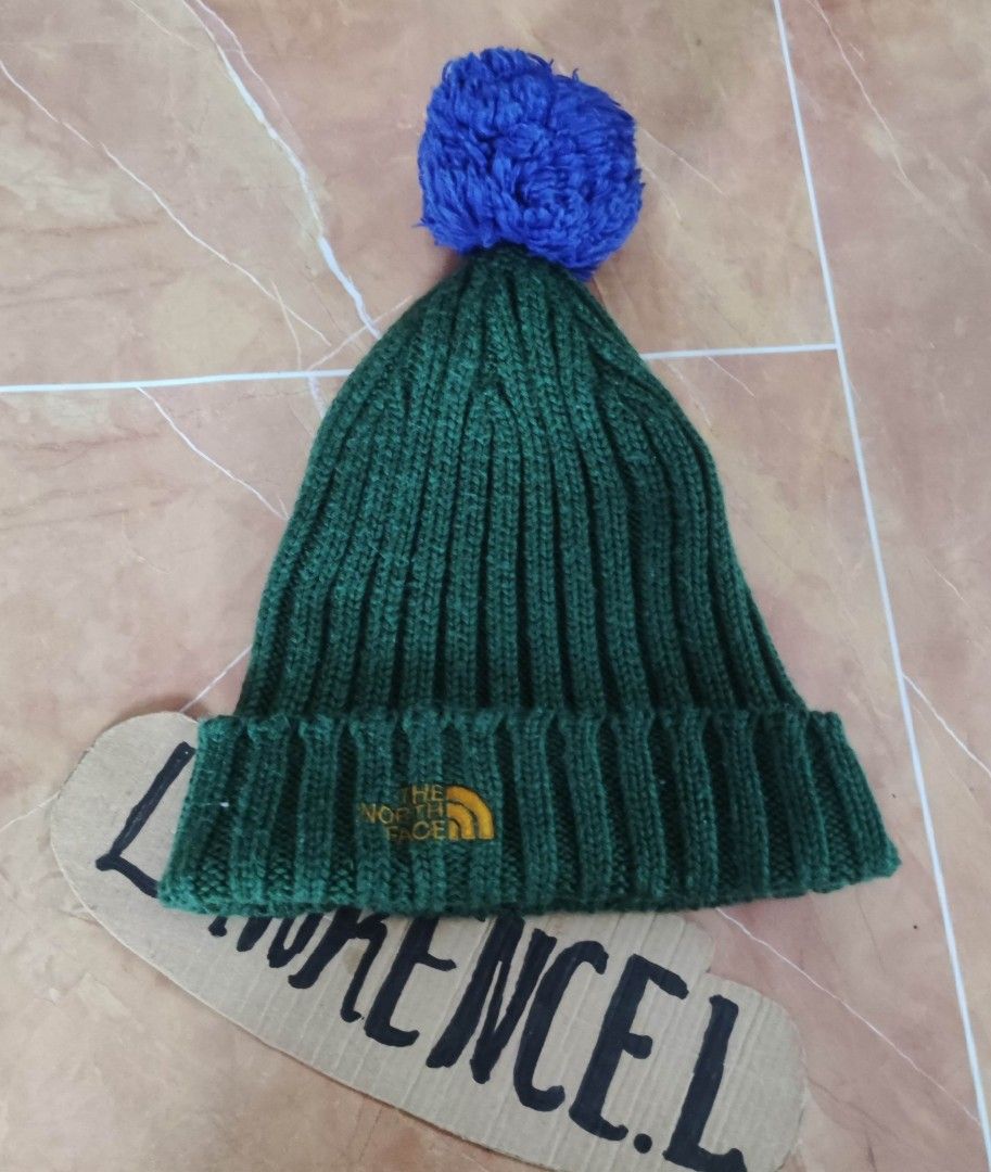 The North Face Beanie with Pom (Category: Hats & Beanies) located in Taguig. Submitted by lawrence_stuff (Listing ID 1393904954, Image 1). Description: - The North Face beanie - Green with blue pom - Embroidered logo - Material: 70% wool, 30% acrylic - Model: NJE3BF53 - One size fits all.