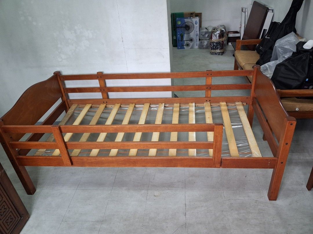Single modular Bed Frame (Category: Bed Frames & Mattresses) located in Manila. Submitted by 88888av (Listing ID 1393816550, Image 2). Description: - Wooden bed frame - Warm brown finish - Includes headboard and footboard - Features a slatted base - Side rails included - One side with lower rail for easy access - Suitable for child or single bed -standard single bed size -bedframe length 79inches and width 39 inches -can be dissabled 8.