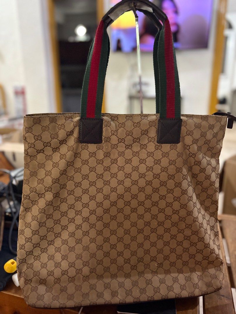 Authentic Gucci tote bag (Category: Luxury Bags & Wallets) located in Paranaque City. Submitted by shopofashopaholic (Listing ID 1394123944, Image 2). Description: Authentic , original Gucci canvas tote bag Large size Cherry line handle No defects Please see last pic for reference.