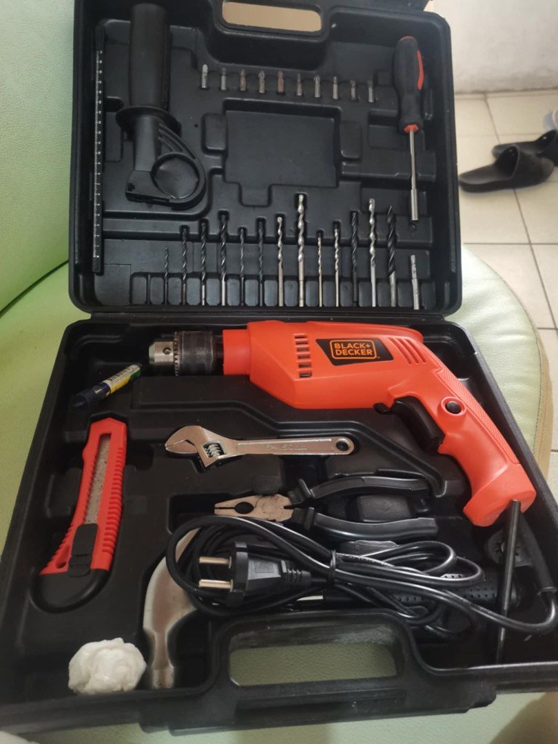 Black+Decker Power Drill Set (Category: Construction Tools & Equipment) located in Las Pinas. Submitted by randomitems01 (Listing ID 1394069615, Image 2). Description: - Black+Decker power drill set - Includes: drill, drill bits, screwdriver, utility knife, wrench, pliers, and hammer - Convenient black carrying case - Features an orange and black drill - Includes user manual - Missing one small drill bit.