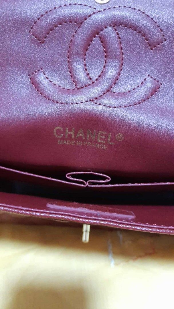 Chanel Classic Double Flap Bag (Category: Luxury Bags & Wallets) located in Manila. Submitted by oscardugan27075 (Listing ID 1394074128, Image 3). Description: - Classic Chanel flap bag - Rich burgundy color - Quilted design - Gold chain strap - Iconic CC turn-lock closure - Burgundy interior with Chanel logo.