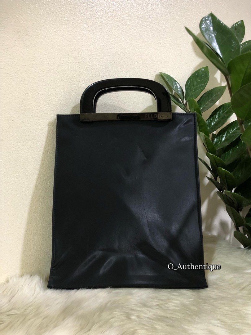 ELLE PARIS TOP HANDLE BAG (Category: Tote Bags) located in Manila. Submitted by o_authentique (Listing ID 1394022210, Image 1). Description: ELLE PARIS •A sleek , minimalist tote bag. •It features a structured silhouette with a unique top handle design. The handles consist of a glossy, rounded component and a metallic bar with the brand name etched on it. •Made in Paris .