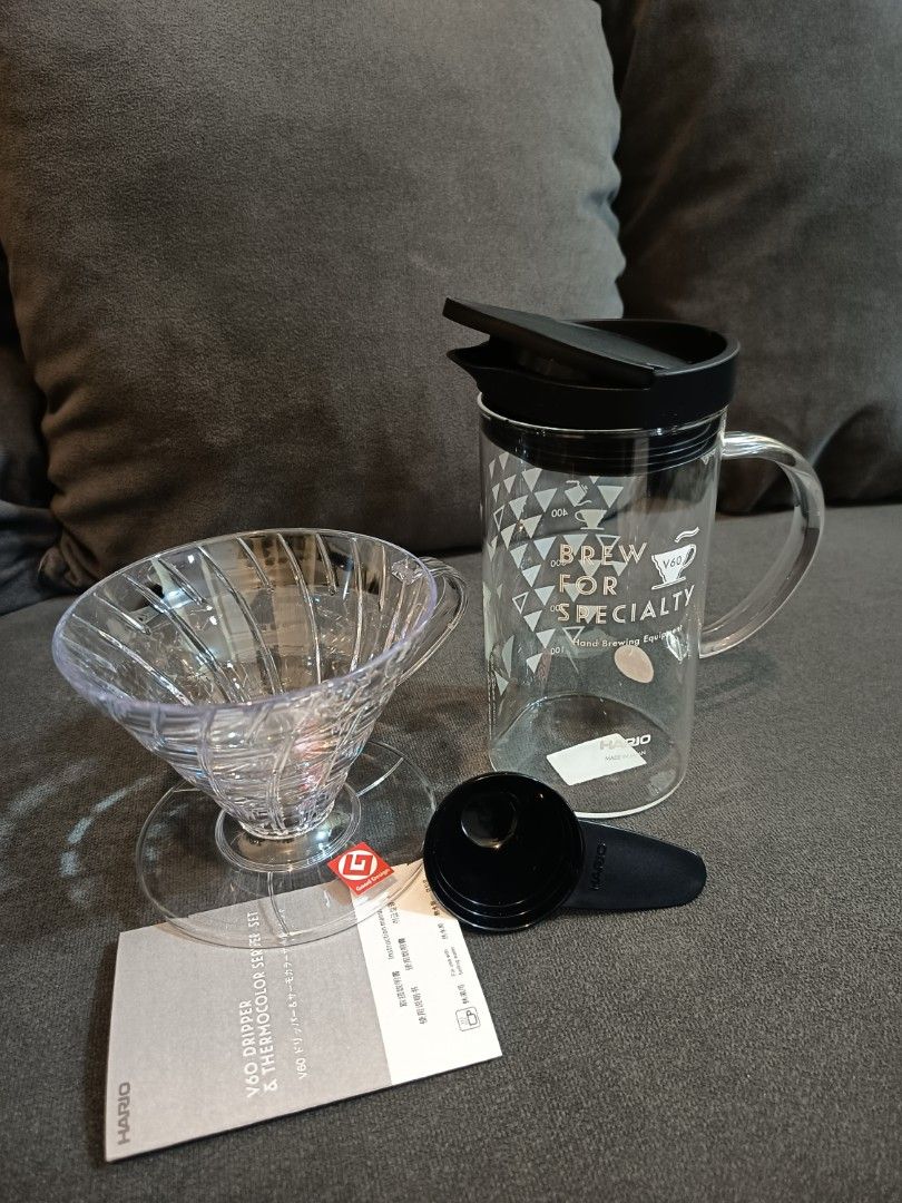 Hario V60 Dripper & Thermocolor Server Set (model VDSS-3012). (Category: Coffee & Tea Tableware) located in Binangonan. Submitted by retrovintagesourceph (Listing ID 1394168703, Image 2). Description: It's a coffee brewing set that includes a V60 dripper and a server. The server features a thermo-color print that changes color based on temperature: "HOT" turns pink and "ICE" turns blue at drinking temperature. The V60 dripper is known for its dis