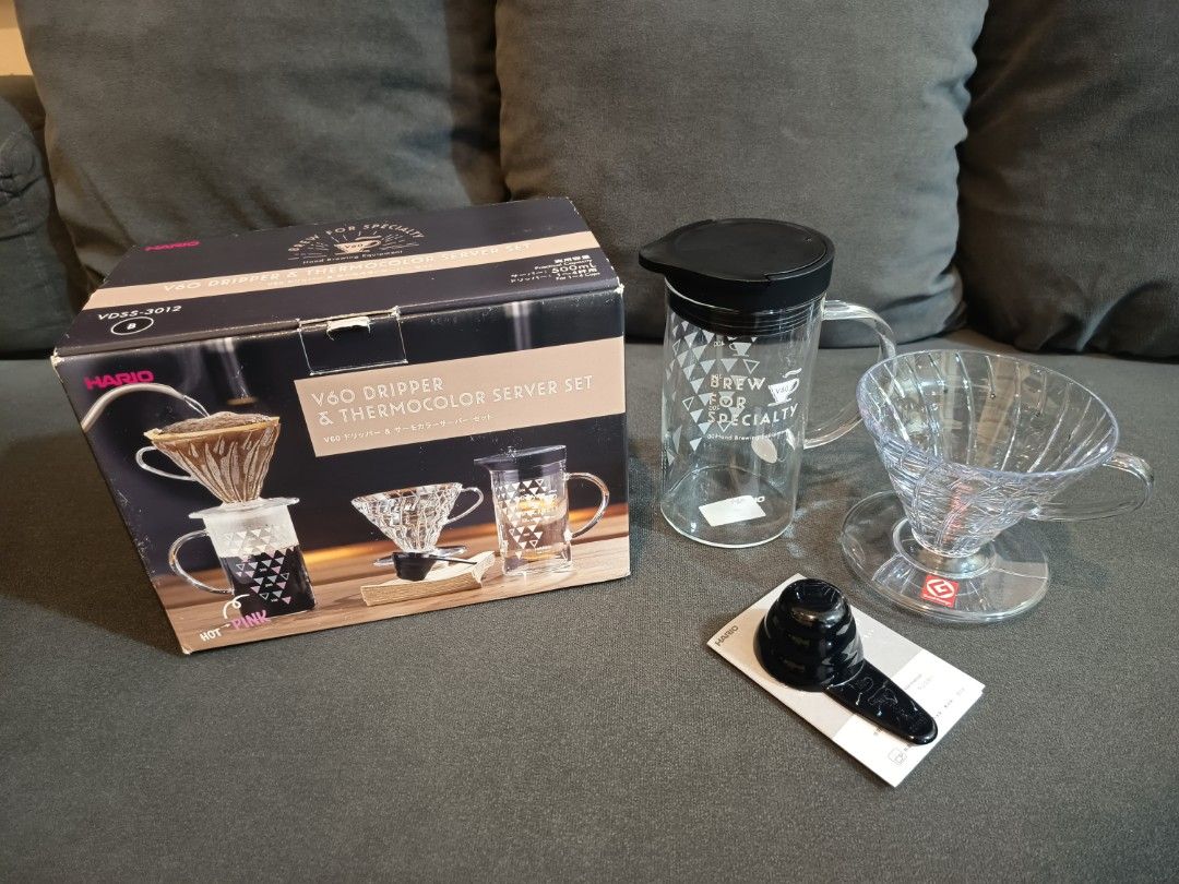 Hario V60 Dripper & Thermocolor Server Set (model VDSS-3012). (Category: Coffee & Tea Tableware) located in Binangonan. Submitted by retrovintagesourceph (Listing ID 1394168703, Image 1). Description: It's a coffee brewing set that includes a V60 dripper and a server. The server features a thermo-color print that changes color based on temperature: "HOT" turns pink and "ICE" turns blue at drinking temperature. The V60 dripper is known for its dis