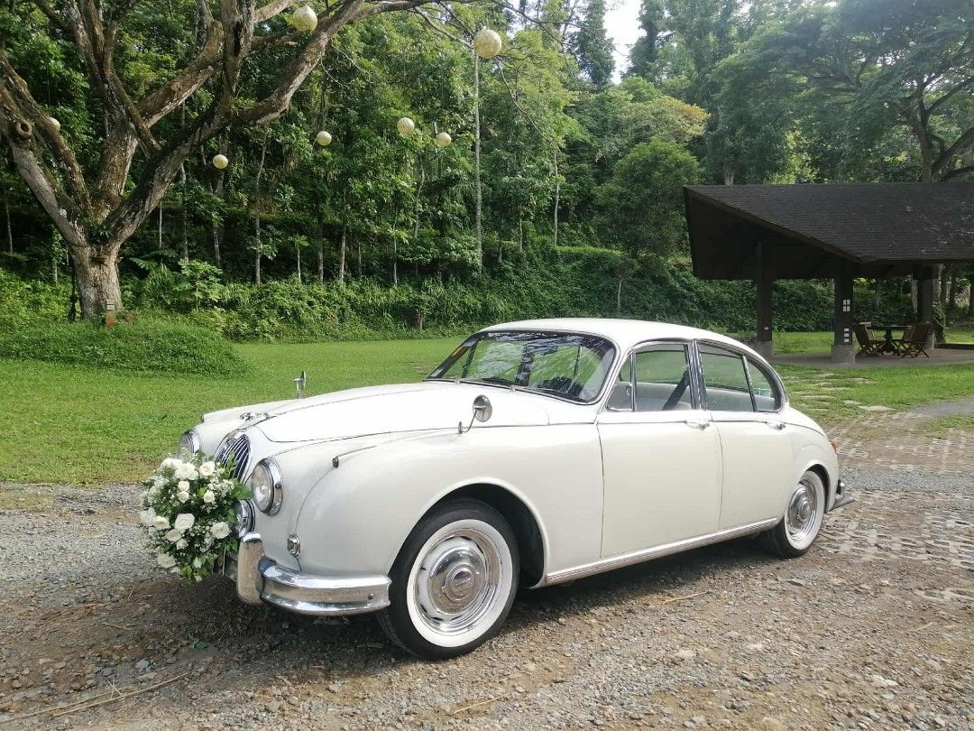 Jaguar Mark II Vintage Car White Bridal Car Luxury Wedding Car (Category: Food, Event & Party Services) located in Manila. Submitted by aperfectdaywedcar (Listing ID 239327450, Image 1). Description: Bridal Car For Rent Vintage Luxury Car "White Bridal car Jaguar Mark II Vintage" Make your special day memorable! other luxury cars also available Route (House/Hotel - Church - Reception) LIKE US ON FACEBOOK: aperfectdaywedcar Happy Wedding God Bless