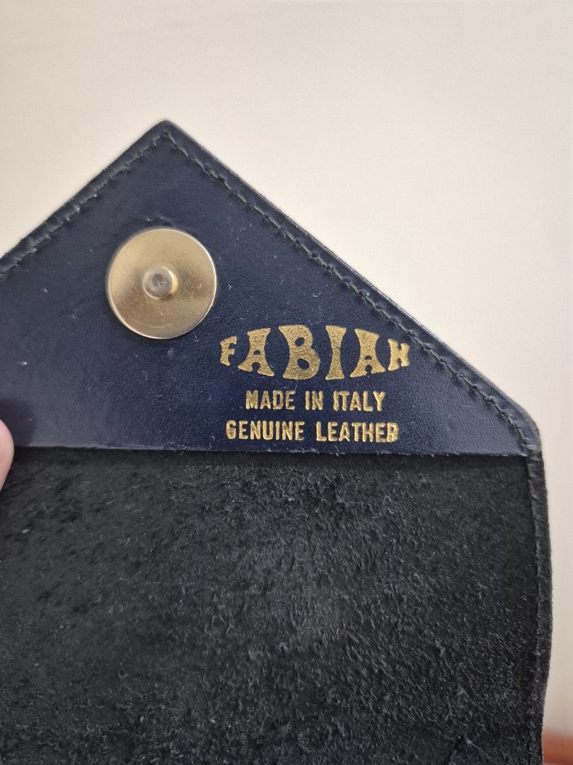 Italian Leather wallet bag (Category: Luxury Bags & Wallets) located in Pasig City. Submitted by 53888 (Listing ID 1394105132, Image 2). Description: made in Italy H7" x 6.5" navy/dark blue fits cellphone and small wallet.