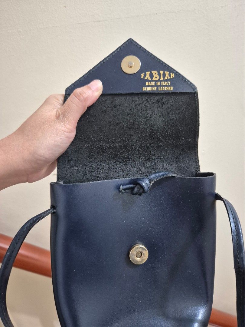 Italian Leather wallet bag (Category: Luxury Bags & Wallets) located in Pasig City. Submitted by 53888 (Listing ID 1394105132, Image 3). Description: made in Italy H7" x 6.5" navy/dark blue fits cellphone and small wallet.
