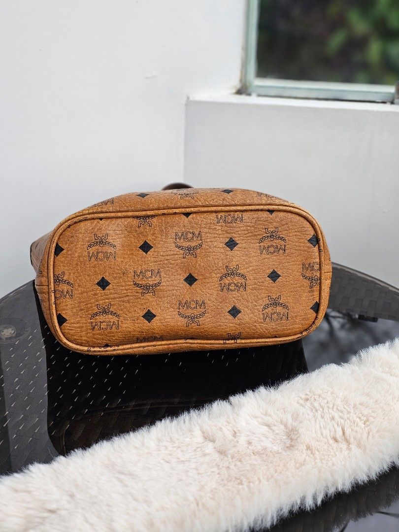 MCM Visetos Cognac Mini Tote (Category: Luxury Bags & Wallets) located in Baguio. Submitted by kayeonlineshop (Listing ID 1394083735, Image 3). Description: 👜 Mini MCM 👜 Via Measuring Tape: H (8"), L (9.5"), W (5") 👜 With signs of use (kunting cracked sa lips ng bag, may rubs sa ilalim ng bag) 👜 Pre-owned Authentic 👜 Zip closure 📌 Shipping via J&T (no to COD) 🏷 MOP: G-cash / Bank transfer.