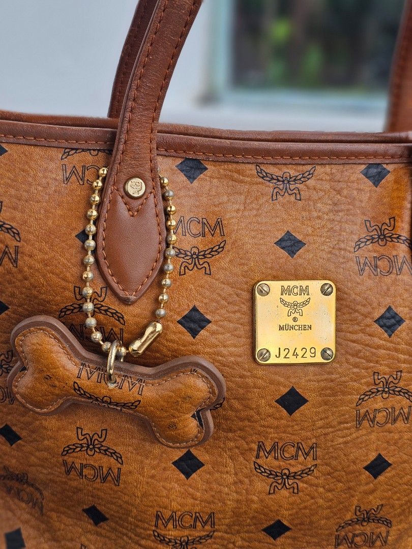 MCM Visetos Cognac Mini Tote (Category: Luxury Bags & Wallets) located in Baguio. Submitted by kayeonlineshop (Listing ID 1394083735, Image 2). Description: 👜 Mini MCM 👜 Via Measuring Tape: H (8"), L (9.5"), W (5") 👜 With signs of use (kunting cracked sa lips ng bag, may rubs sa ilalim ng bag) 👜 Pre-owned Authentic 👜 Zip closure 📌 Shipping via J&T (no to COD) 🏷 MOP: G-cash / Bank transfer.