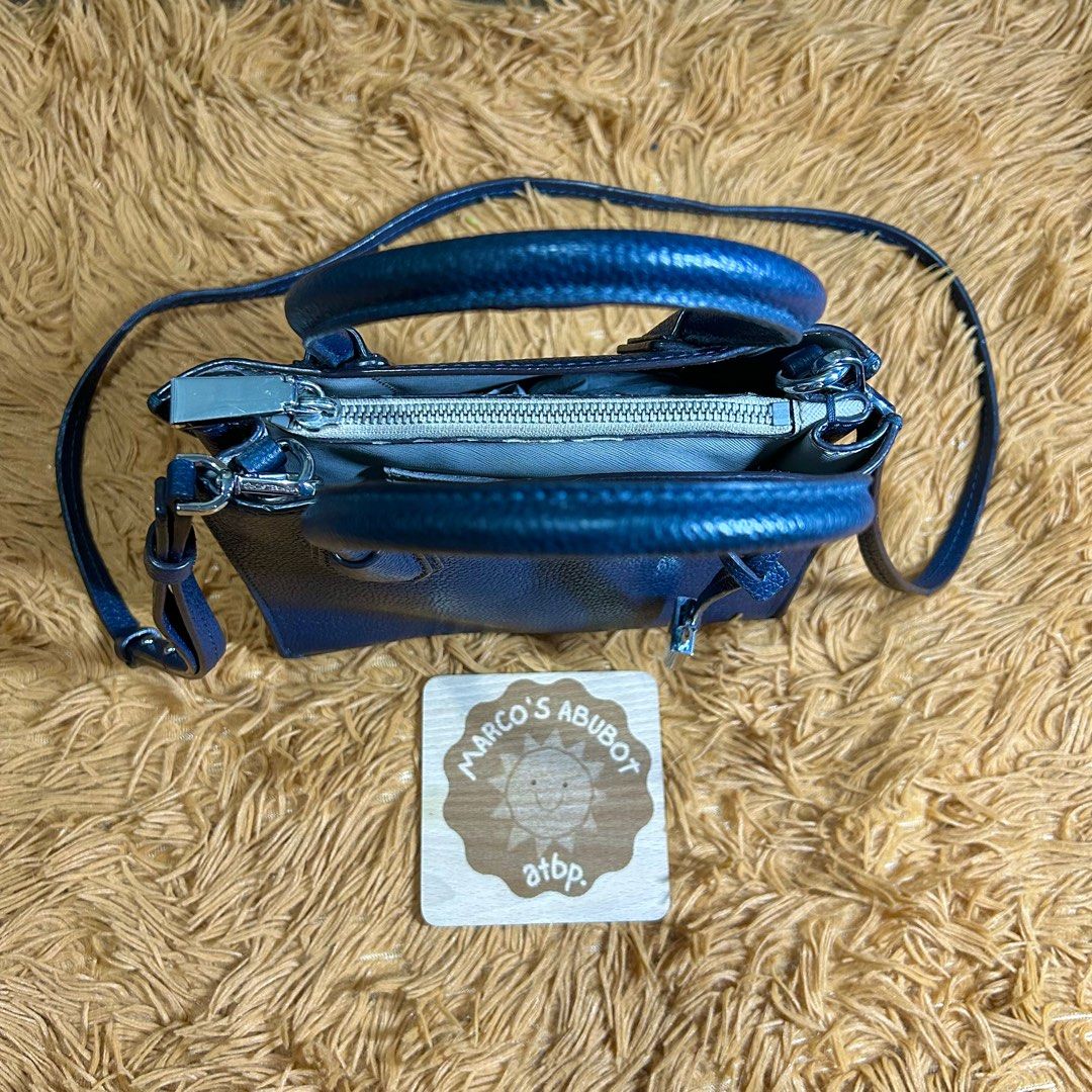 Michael Kors Mercer Midnight Blue (Small Size) (Category: Cross-body Bags) located in San Juan City. Submitted by marcosabubotatbp (Listing ID 1394061033, Image 2). Description: Soft pebbled leather Original Bought it thru personal shopper in Canada Iphone pro max can fit Excellent condition pa po yung leather part ng body Midnight blue in color Detachable sling can be used as top handle bag stand alone as well Bottom studs/feet still intact but 